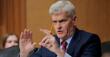 Sen. Bill Cassidy, R-La., gestures during a Senate committee hearing on March 14.