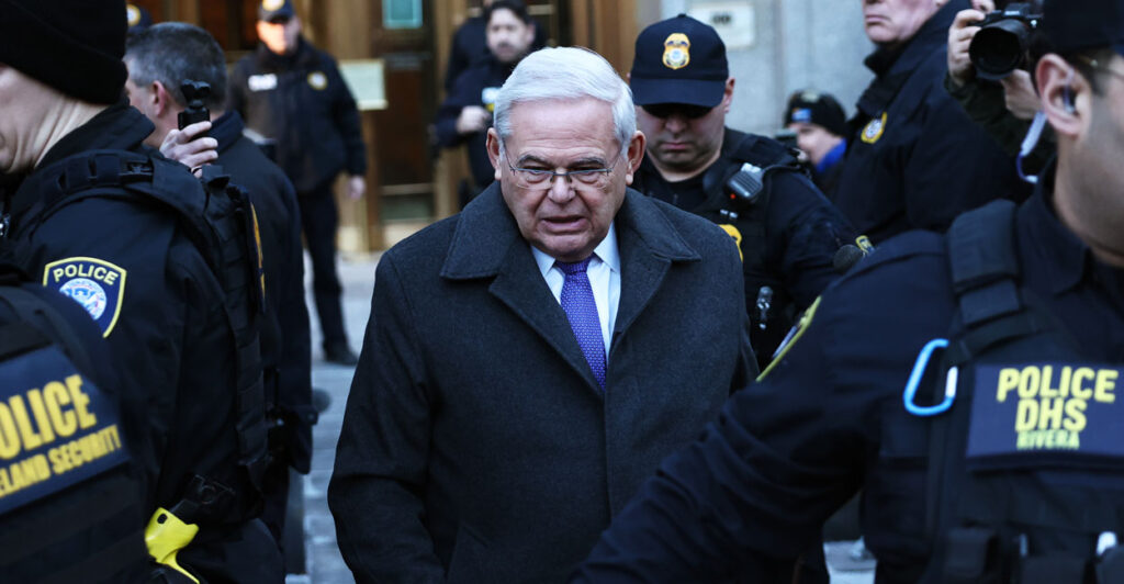 Surrounded by police officers, lawyers, onlookers, and others, former senator Bob Menendez, D-N.J., leaves federal court in Manhattan after his sentencing on Jan. 29 in New York City.