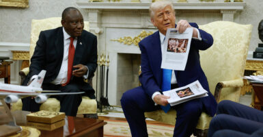 President Donald Trump, hosting South African President Cyril Ramaphosa at the White House on Wednesday, showed reporters accounts of racist violence against whites in South Africa.