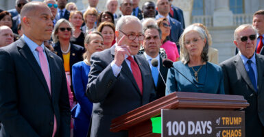 Senate Minority Leader Charles Schumer, D-N.Y. (center), House Minority Leader Hakeem Jeffries, D-N.Y. (left), and fellow Democratic lawmakers critique the first 100 days of President Donald Trump's second term in the White House outside the Capitol on April 30.