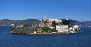 Alcatraz Island under a clear blue sky.