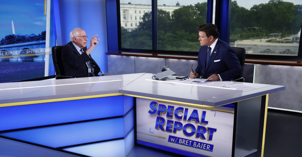 Bernie Sanders points at Fox News's Brett Baier during an appearance on Special Report.