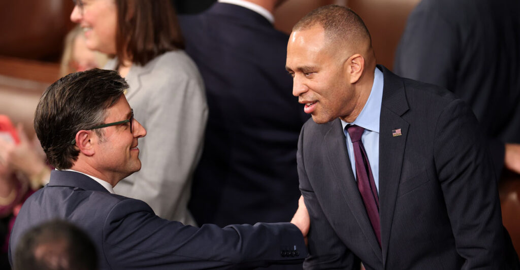Rep. Mike Johnson, R-La. (left), chats with Rep. Hakeem Jeffries, D-N.Y., as the House votes for speaker on the first day of the 119th Congress on Jan. 3.
