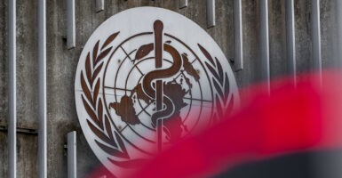 The World Health Organization logo next to its headquarters in Geneva, Switzerland.