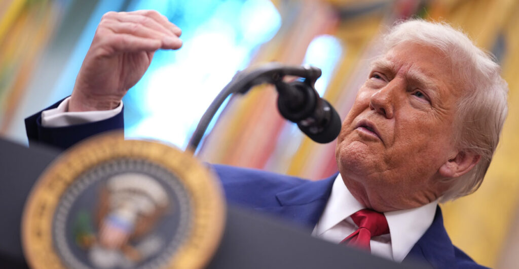President Donald Trump, behind a lectern and microphone