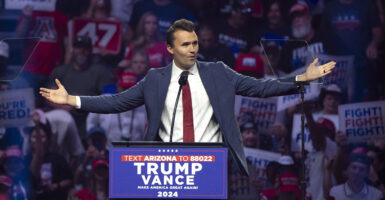 Turning Point USA President Charlie Kirk gestures