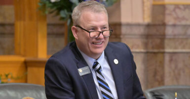 Colorado state Sen. Chris Kolker in a blue suit with a striped tie
