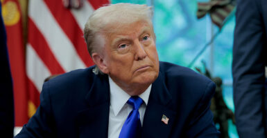 Donald Trump in a blue suit with a blue tie