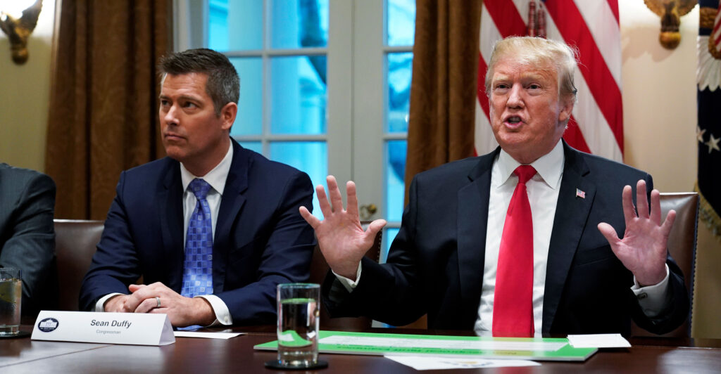 Donald Trump and Sean Duffy sit next to each other in the White House.