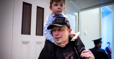Elon Musk gives son X Æ a piggyback ride at the Capitol.