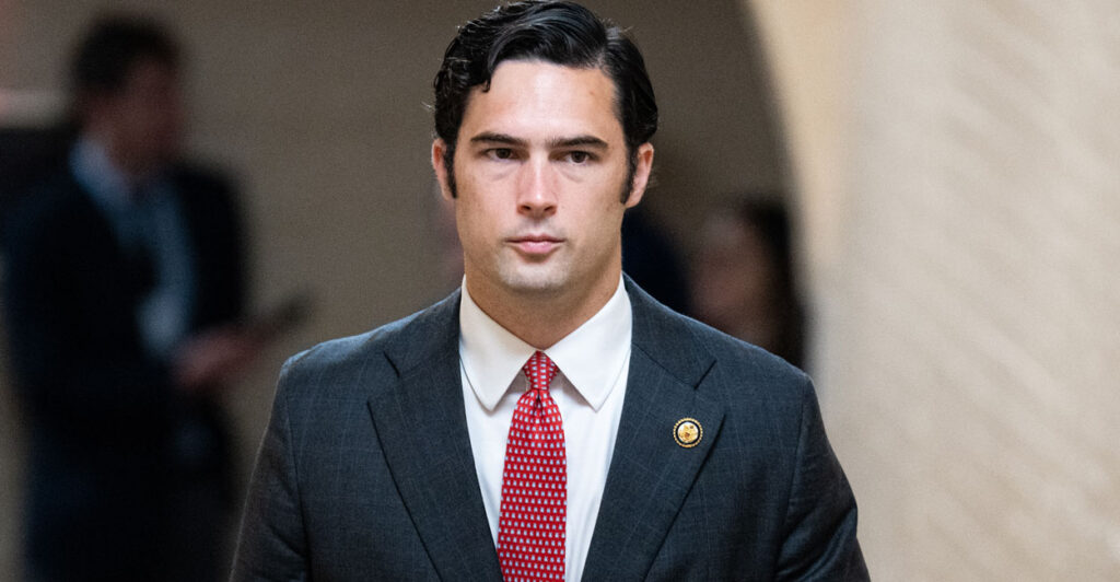 The Clark Kent lookalike freshman congressman Brandon Gill looking somber.