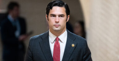 The Clark Kent lookalike freshman congressman Brandon Gill looking somber.