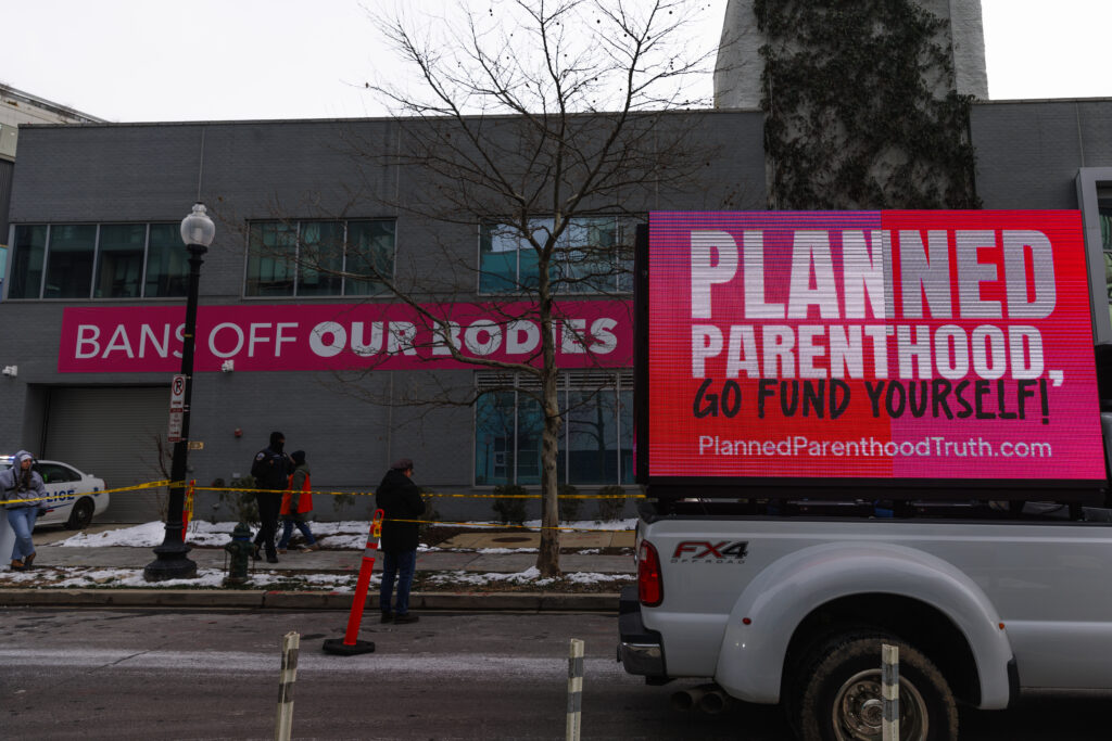 Pro- and anti-abortion protesters square off in front of a Planned Parenthood clinic in Washington, D.C., on Jan. 18, 2024.