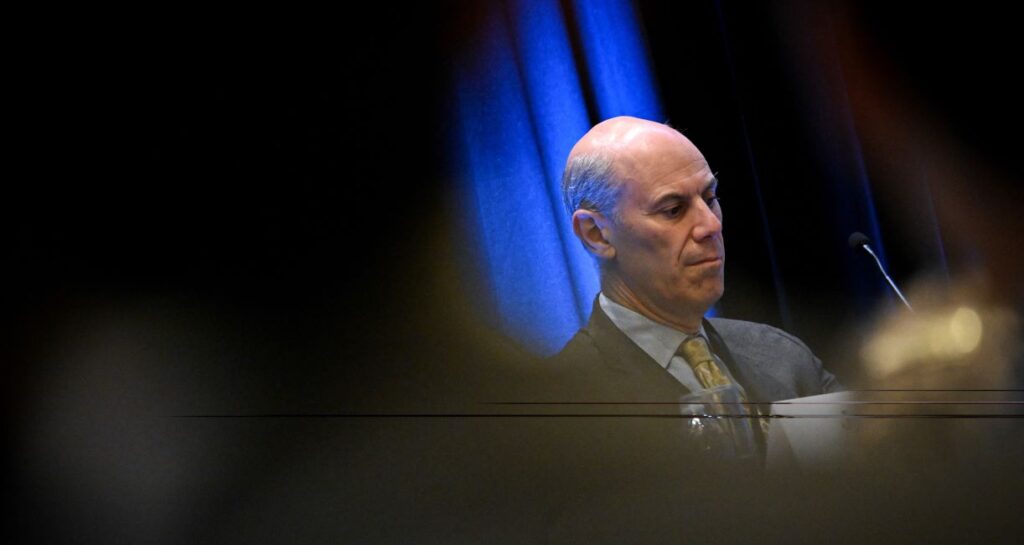 James Boasberg, chief judge of the US District Court for the District of Columbia, seen in profile through a peephole effect.
