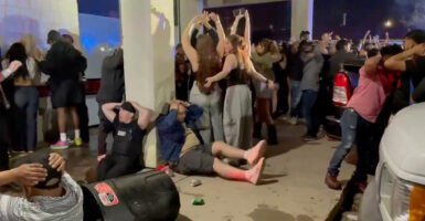 More than 300 law enforcement officers from 13 federal, state, and local agencies raid an illegal nightclub in Colorado Springs, Colorado.