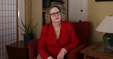 Kerry Doyle in a red suit