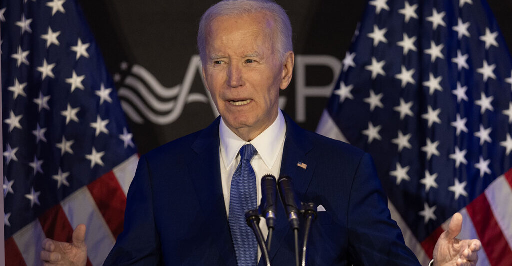 Joe Biden blue suit American flags