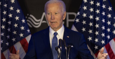 Joe Biden blue suit American flags