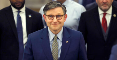 a smiling speaker of the House Mike Johnson, R-La.