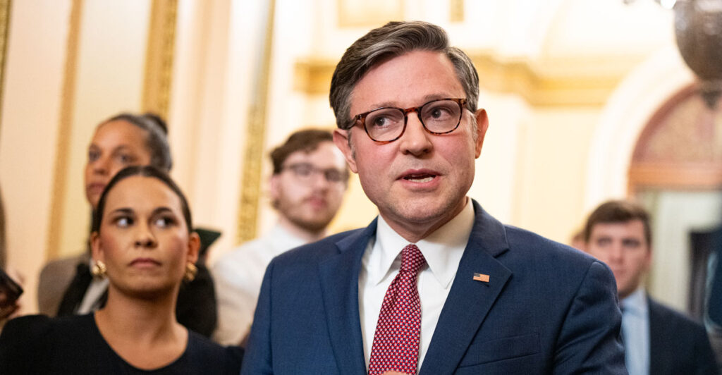 Speaker of the House Mike Johnson, R-La., stops outside the House chamber Thursday to speak to reporters about the ongoing budget reconciliation negotiations.
