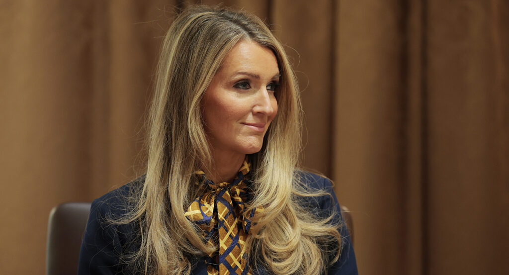 Kelly Loeffler with a checkered scarf