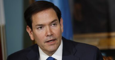 Marco Rubio looks to his left while giving a speech.