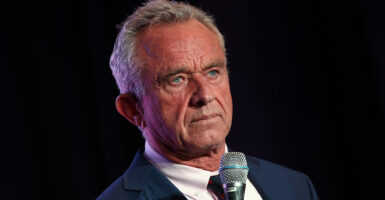 Robert F. Kennedy Jr. holding a microphone