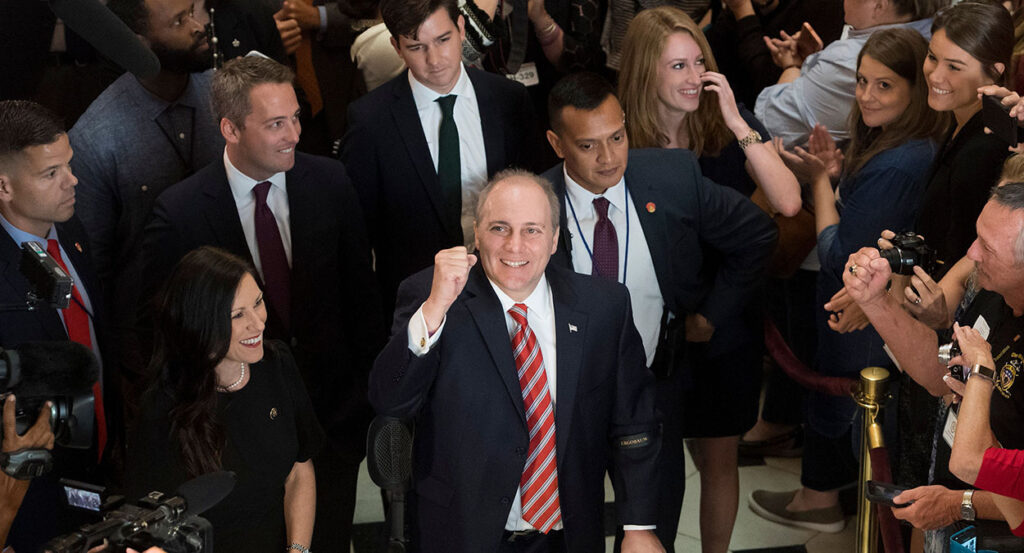 Steve Scalise raises his fist
