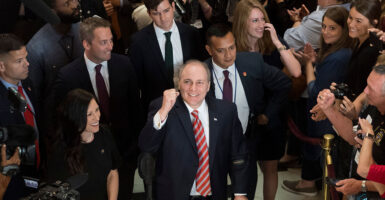 Steve Scalise raises his fist