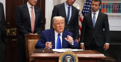 Trump signs an executive order.