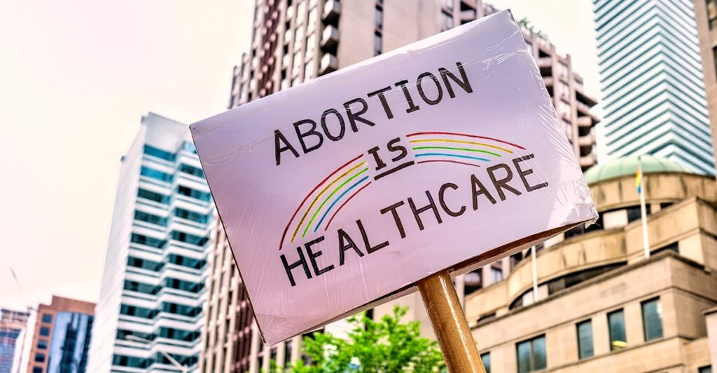 A pro-abortion sign says, "Abortion is healthcare."