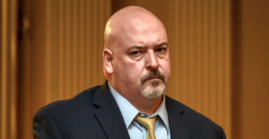 Virginia House Minority Leader and state Del. Todd Gilbert in a black suit and yellow tie