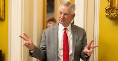 Sen. Tommy Tuberville, R-Ala., wearing a white shirt with a red tie.