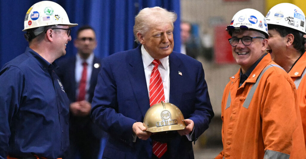 Donald Trump, gold hard hat in hand, jokes with three steel workers.