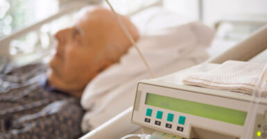 An elderly man on palliative care in a hospital setting