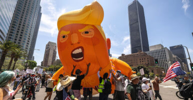 Thousands of protesters rally in Los Angeles on Saturday at a demonstration against President Donald Trump, including with a gigantic balloon caricaturing him.