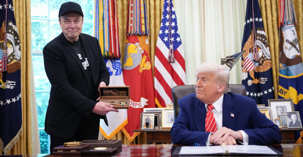 Tech titan Elon Musk holds a ceremonial key given to him by President Donald Trump in the Oval Office on May 30.