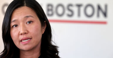 A closeup photo of Boston Mayor Michelle Wu speaking to reporters