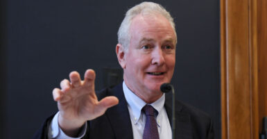 Sen. Chris Van Hollen of Maryland, with his hand extended.