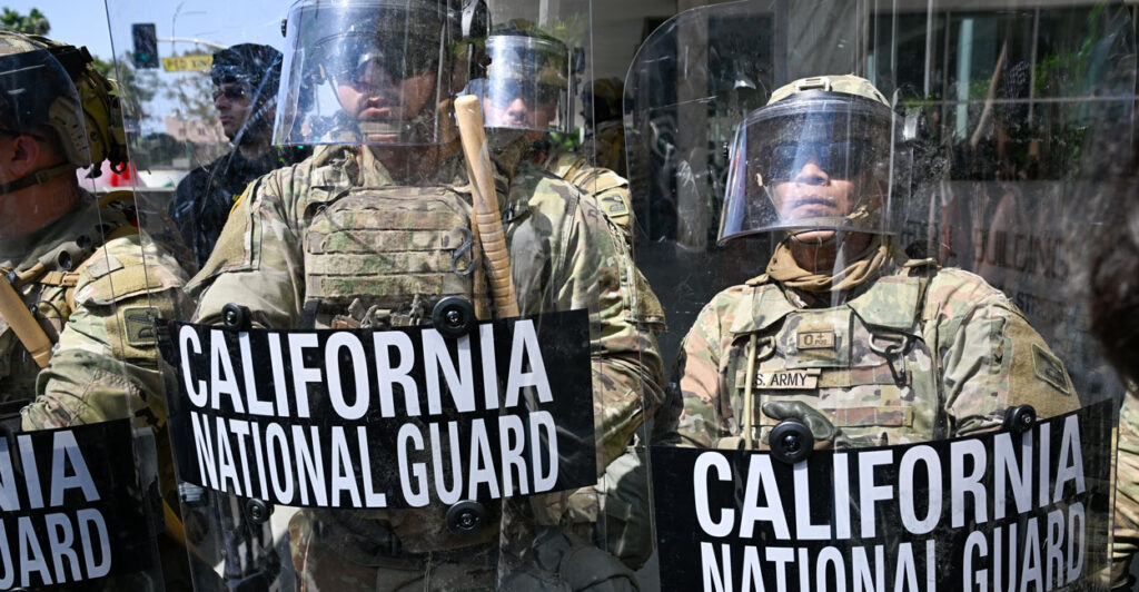 National Guard troops protect a federal building in Los Angeles on Monday.