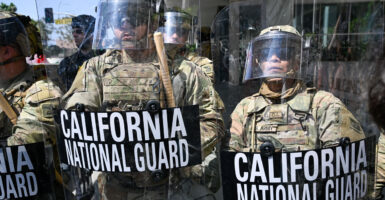 National Guard troops protect a federal building in Los Angeles on Monday.