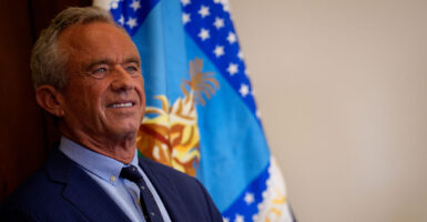 A smiling Robert F. Kennedy Jr. in three-quarter profile.