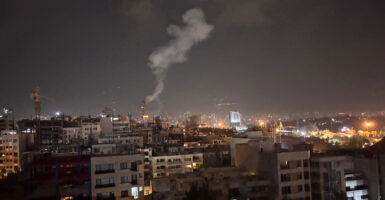 Smoke seen rising over buildings in Tehran following Israeli strikes on Iran.