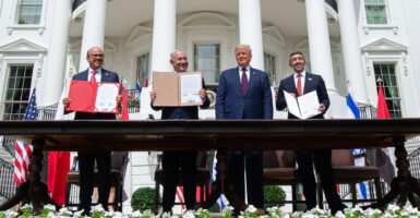 From left: Bahraini Foreign Minister Abdullatif Al Zayani, Israeli Prime Minister Benjamin Netanyahu, President Donald Trump, and UAE Foreign Minister Abdullah bin Zayed Al Nahyan hold up documents after participating in the signing of the Abraham Accords at the White House on Sept. 15, 2020.