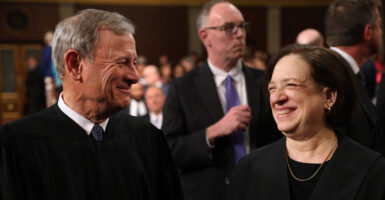 Chief Justice John Roberts and Justice Elena Kagan share a laugh before President Donald Trump's address to Congress.