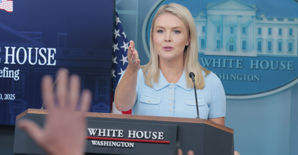White House Press Secretary Karoline Leavitt stands at the podium in the press room at the White House taking questions from the media
