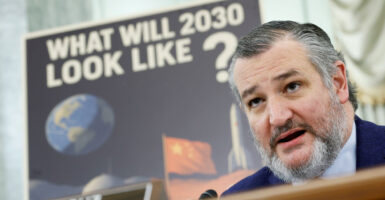 Sen. Ted Cruz, R-Texas, is seen here April 9 chairing a Senate Commerce, Science, and Transportation Committee hearing, with a sign behind him reading "What will 2030 look like?"
