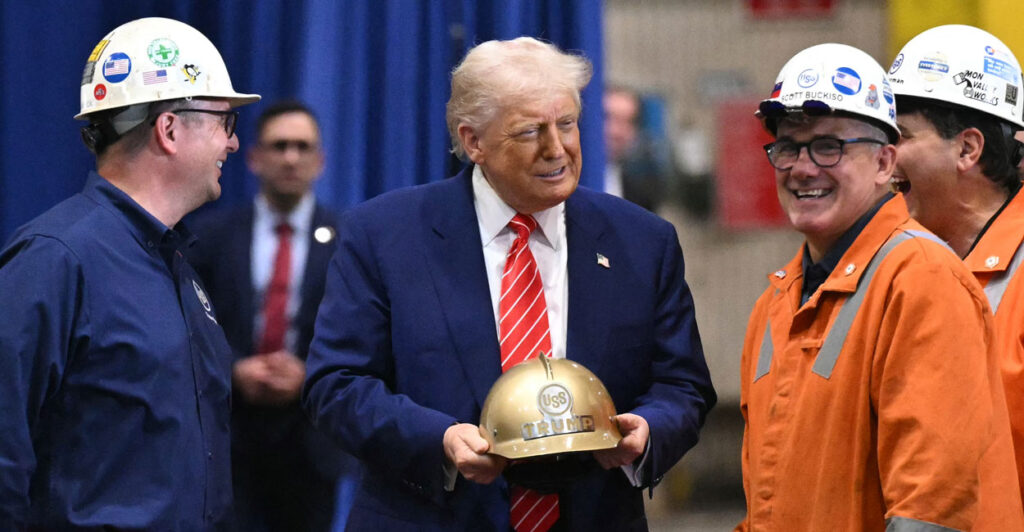 President Donald Trump chats it up with steelworkers wearing hard hats who presented him with one of his own with his name on it.