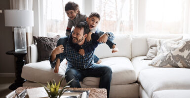 Father playing with sons.