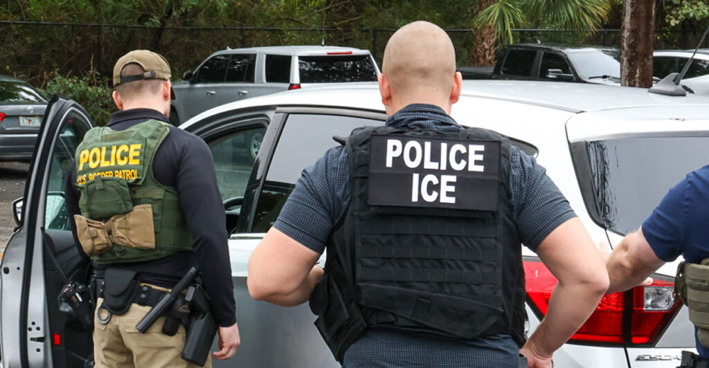 ICE officers, with assistance from Homeland Security Investigations and Border Patrol, perform enforcement operations in Delray Beach, Florida, on Jan. 23.